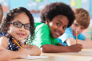 Three happy children learning