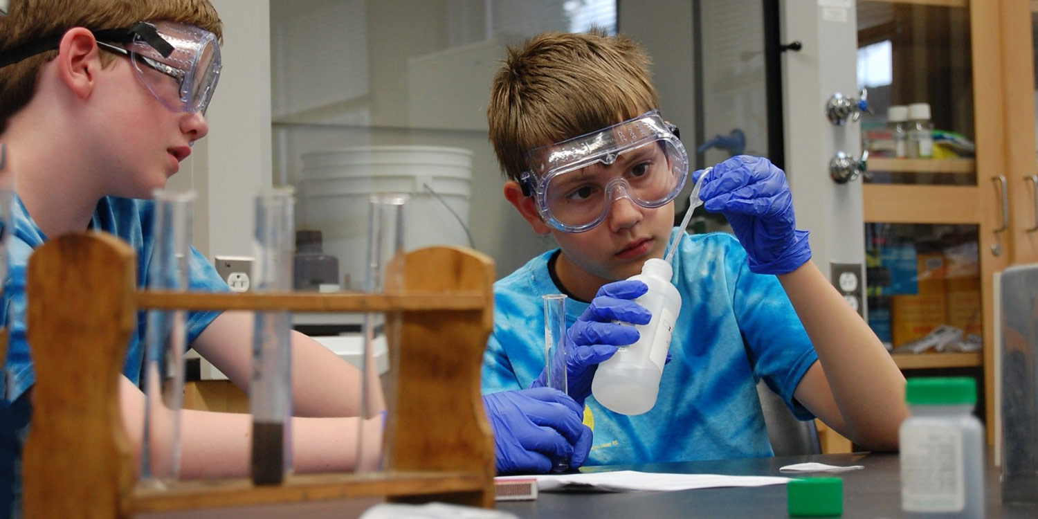 Student running science experiment